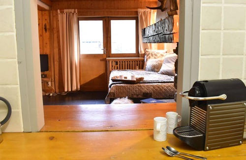 Meribel Centre Apartment | Cozy apartment for 5, central Méribel, south-facing balcony, divided living area, ski locker