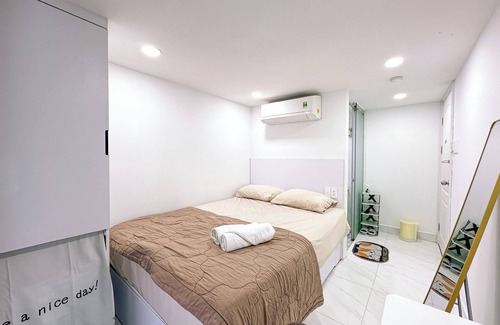 Tan Qui Dong Apartment | Cozy budget room in D7 with chill rooftop