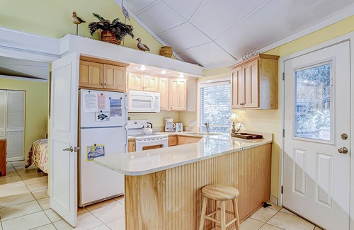 Night Heron Condo | Cozy bungalow offers privacy, shared pool, and beach access via dedicated trail