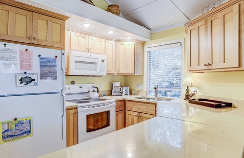 Night Heron Condo | Cozy bungalow offers privacy, shared pool, and beach access via dedicated trail