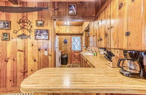 West Village Cabin | Cozy cabin in the trees with deck, grill, wood-burning fireplace, WiFi, & W/D