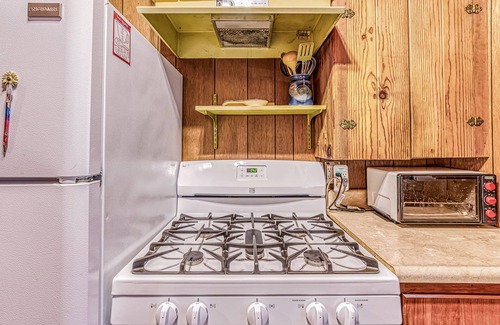 West Village Cabin | Cozy cabin in the trees with deck, grill, wood-burning fireplace, WiFi, & W/D