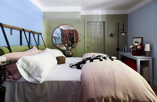 Lenox Bed & Breakfast | Cozy Carriage House room with a double bed and private balcony