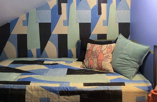 Lenox Bed & Breakfast | Cozy Carriage House room with a double bed and private balcony