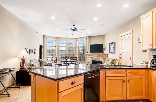 Three Lakes Condo | Cozy condo w/ lake-view, balcony, fireplace, pool, game room, & washer/dryer