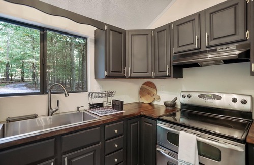 The Woods House | Cozy getaway in the woods of Hedgesville, WV. Pet friendly!