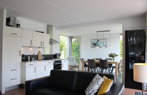 Langweer House | Cozy holiday home on the water with a terrace and jetty