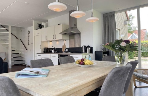 Langweer House | Cozy holiday home on the water with a terrace and jetty