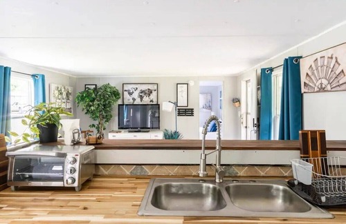 Danville House | Cozy home with butcher block counter tops, custom live-edge walnut bar top