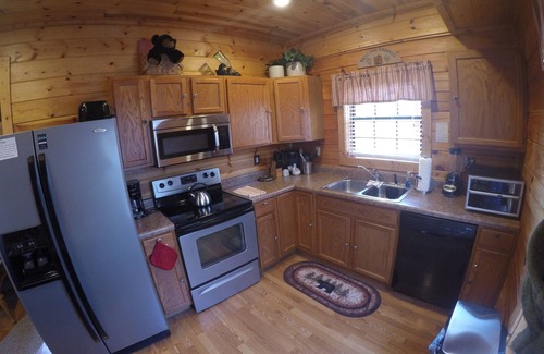 Gatlinburg - Pigeon Forge Cabin | Cozy Log Home, Centrally Located, 2 Master Suites, Hot Tub, Game and Movie Rooms