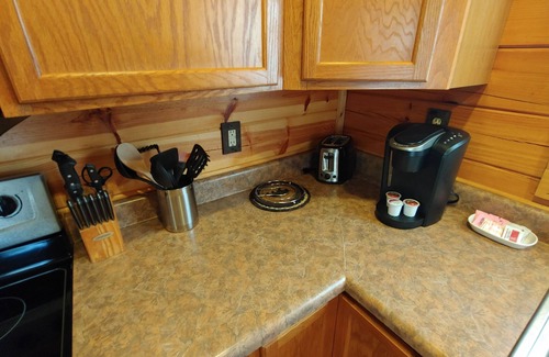 Gatlinburg - Pigeon Forge Cabin | Cozy Log Home, Centrally Located, 2 Master Suites, Hot Tub, Game and Movie Rooms