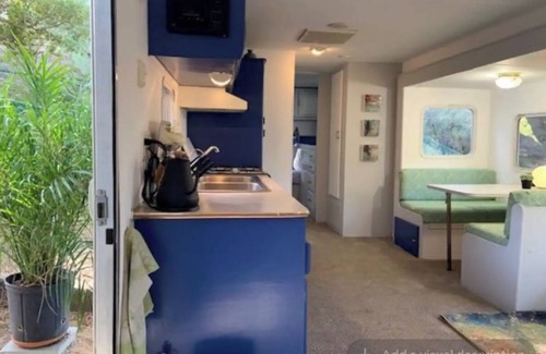 Topanga House | Cozy Mallard RV. Light, bright and inspiring trailer amongst the Pine trees.
