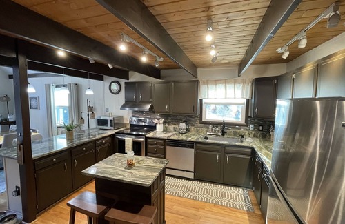 East Stroudsburg Ski Chalet | Cozy Poconos retreat directly on Bushkill Creek w/firepit & wood pellet stove!