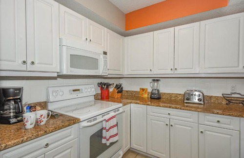 New Smyrna Beach Apartment | Cozy up in this gorgeous coastal themed 32 condo with views of the estuary OW10-303