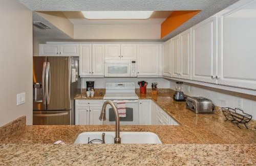 New Smyrna Beach Apartment | Cozy up in this gorgeous coastal themed 32 condo with views of the estuary OW10-303