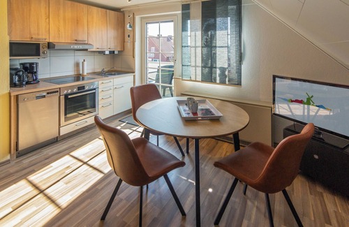 Westeraccumersiel Apartment | Cozy upper apartment Smutje with infrared cabin