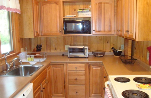 Harrison House | Cozy waterfront cottage on private land with beautiful sunsets over Long Lake