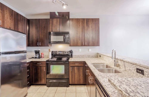 Central Business District Apartment | CozySuites at the Banks gym, pool 03