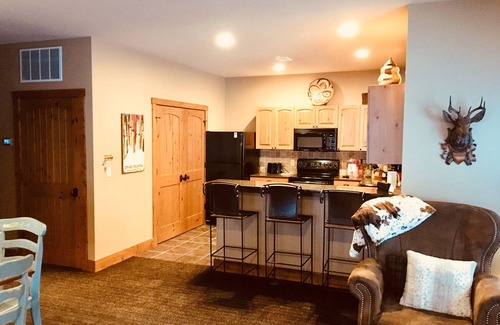 Boyne City Condo | Creekside Condo w/private hot tub at Boyne! Ski-in/Ski-out, Golf, Bike, Swim