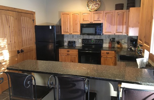 Boyne City Condo | Creekside Condo w/private hot tub at Boyne! Ski-in/Ski-out, Golf, Bike, Swim
