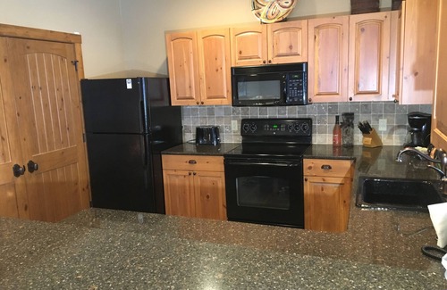 Boyne City Condo | Creekside Condo w/private hot tub at Boyne! Ski-in/Ski-out, Golf, Bike, Swim