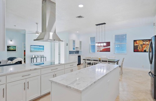 Palm City House | Deep water front home with private dock, pool, outdoor kitchen and pool table.