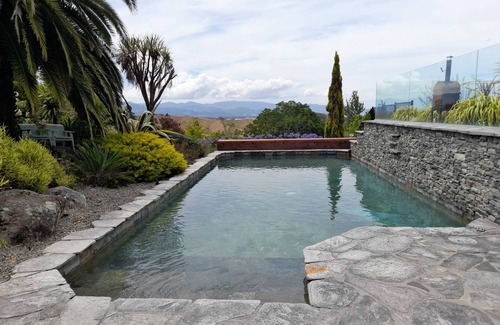 Tasman Cottage | Delightful sunny house with stunning rural & ocean views, swimming pool & spa