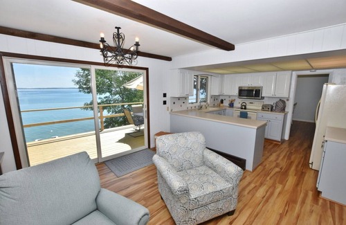 Suttons Bay House | Direct waterfront on West Grand Traverse Bay! Overlooking deck