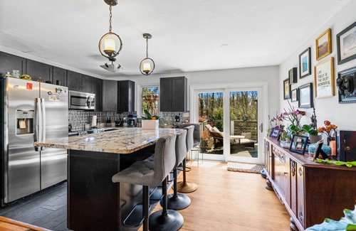 Asheville House | Discover Gothic Mountain Retreat Clawfoot Tub, Lush Deck, and Tranquil Coy Pondn