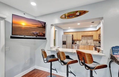 Florida North Atlantic Coast House | Discover the ultimate getaway at our stylish 3-bedroom retreat featuring 7 cozy beds, 2 modern bathrooms, a private pool, hot tub (extra fee), outdoor TV, BBQ grill, and a refreshing outdoor shower—your perfect blend of comfort, relaxation, and fun.