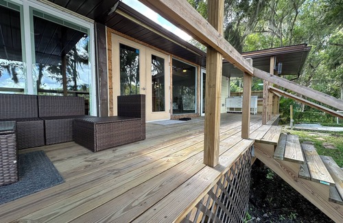 Land O' Lakes Cabin | Discover tucked away 5-bedroom lakefront cabin getaway in Land O' Lakes with AC