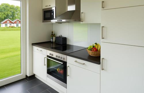Nordhorn House | Dock 61 - tolles Ferienhaus für bis zu 4 Personen mit Kaminofen und Sauna - Haustiere herzlich willkommen, direkt am Wasser gelegen