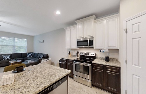 Westside House | Dog-friendly home with a screened porch, washer/dyer, games & modern charm