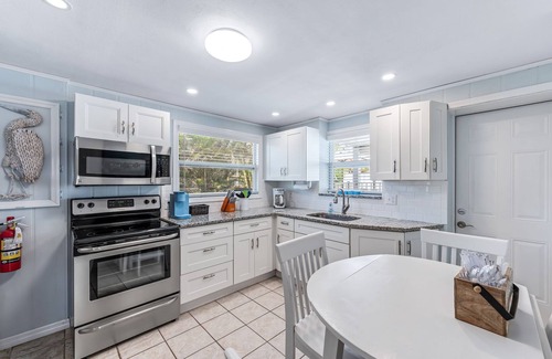 Fort Myers Beach Apartment | Dog Friendly, Large Heated Pool, Short Walk to Restaurants and Beach!