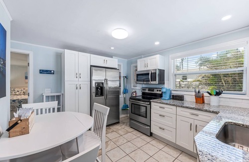 Fort Myers Beach Apartment | Dog Friendly, Large Heated Pool, Short Walk to Restaurants and Beach!
