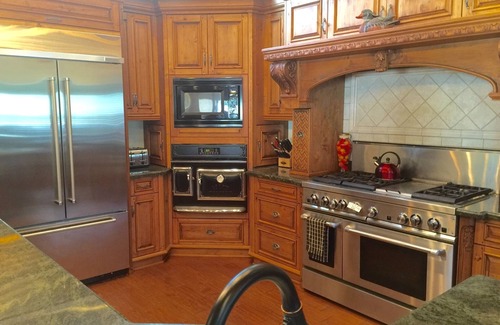Bass Lake House | Dog-friendly, lake view home with a boat slip, three decks, fireplace & WiFi