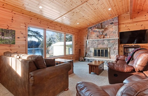 Presque Isle House | Dog-friendly lakefront cabin w/wood fireplace, patio & firepit - kayaks & canoe!