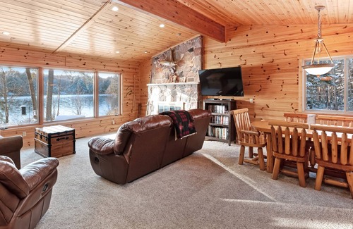 Presque Isle House | Dog-friendly lakefront cabin w/wood fireplace, patio & firepit - kayaks & canoe!
