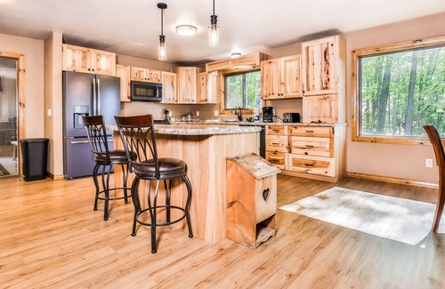 Arbor Vitae House | Dog-friendly, lakefront retreat with a dock, washer/dryer, central AC, & firepit