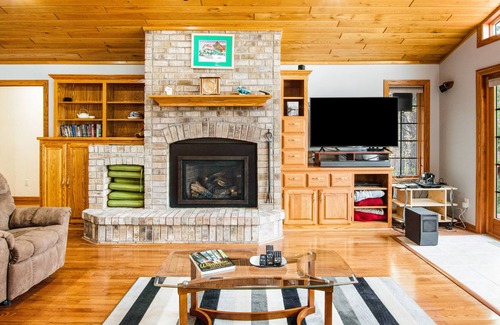 Rhinelander House | Dog-friendly lakefront home with deck, lake views, grill, fireplace, patio, AC