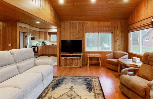Three Lakes Cabin | Dog-friendly lakefront property with dock, boat lift, firepit, & two kitchens
