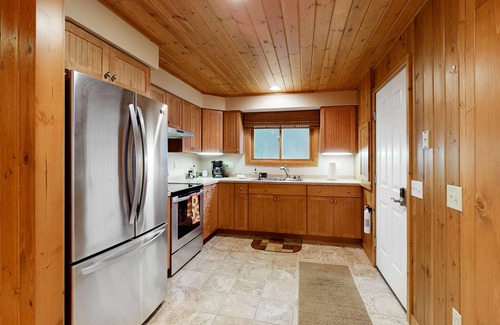 Three Lakes Cabin | Dog-friendly lakefront property with dock, boat lift, firepit, & two kitchens