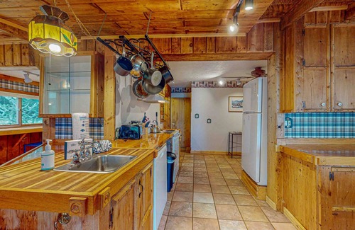 Presque Isle House | Dog-friendly lakefront home with boat access, deck, fireplace, gas grill, kayaks