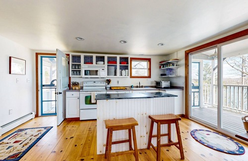 East Boothbay House | Dog-friendly river-view home with wood stove, deck, patio, dock, beach, grill