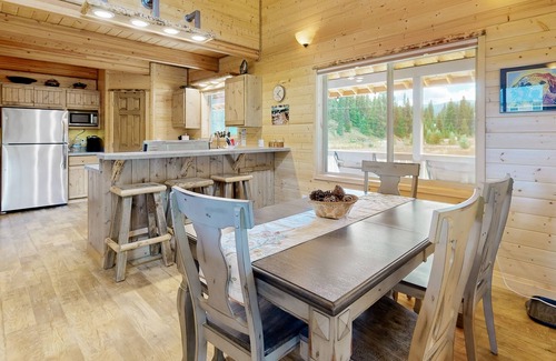 Elk City House | Dog-friendly riverfront home near town with deck, water views, & fireplace