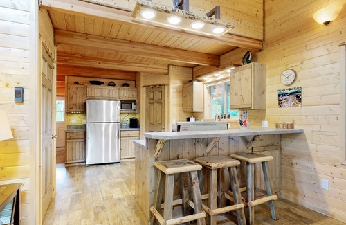 Elk City House | Dog-friendly riverfront home near town with deck, water views, & fireplace