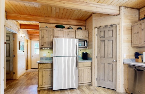 Elk City House | Dog-friendly riverfront home near town with deck, water views, & fireplace