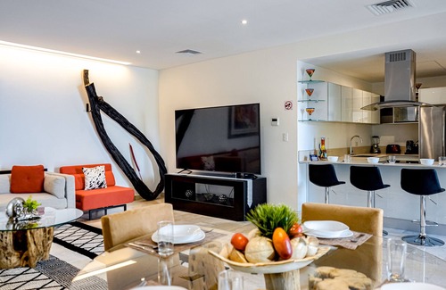 Gonzalo Guerrero Apartment | Dream getaway near the beach and city with pool, balcony, gym, fast WiFi & W/D