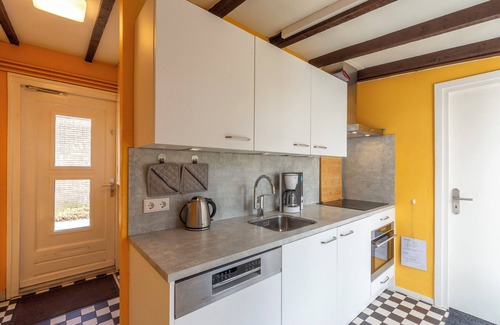 Sint Maartenszee House | Duinland 135, een Gezellige Vakantiebungalow in Sint Maartenszee met een Groene Tuin met Veel Privacy