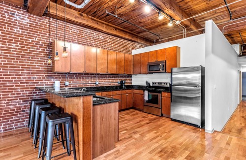 Downtown West Apartment | DWTN Loft✦160" Theater Screen✦Walk to Attractions✦Private Balcony